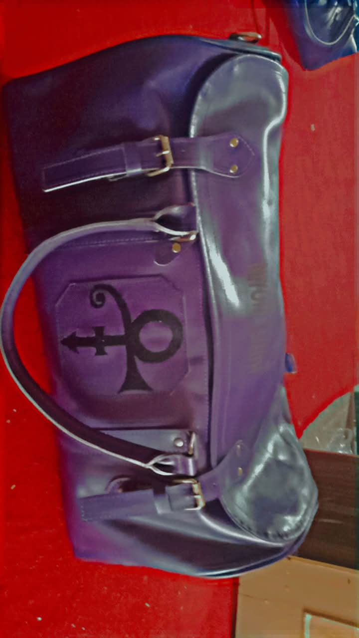 Here is a breakdown of the custom purple duffel/travel bag shown in the images:
