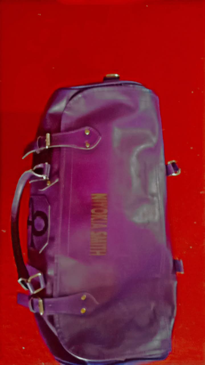 Here is a breakdown of the custom purple duffel/travel bag shown in the images: