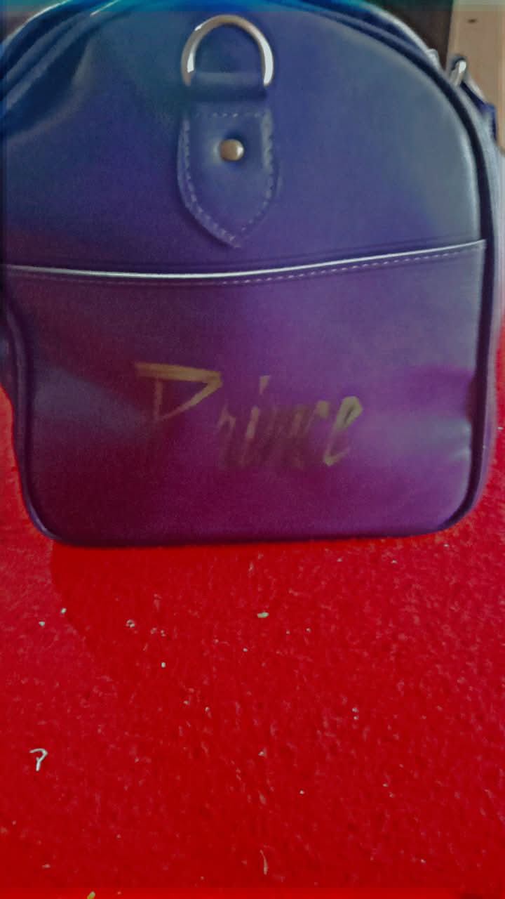 Here is a breakdown of the custom purple duffel/travel bag shown in the images: